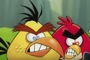Dos pájaros animados enfadados, uno amarillo y otro rojo, con cejas prominentes y expresiones de enojo