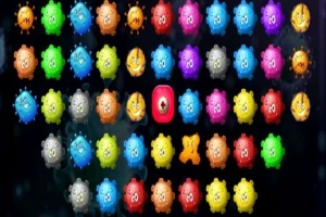 Patrón de pequeñas criaturas redondas de colores brillantes con caras expresivas en un fondo oscuro