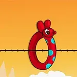 Anillo rojo con cabeza de ratón y lunares azules sobre una cuerda en un fondo naranja