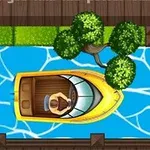 Vista superior de un bote amarillo navegando por un canal de agua rodeado de árboles y césped