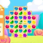 Interfaz colorida de un juego de puzles con piezas en forma de caramelos de varios colores y una barra de progreso a la derecha