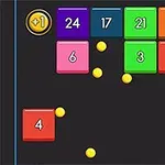 Bloques de colores con números y bolas amarillas en un fondo oscuro