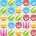 Dulces de colores brillantes alineados en filas sobre un fondo claro