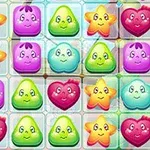 Caramelos coloridos con caras felices en forma de corazón, estrella y gota organizados en una cuadrícula