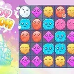 Un castillo de fantasía a la izquierda y una cuadrícula de criaturas coloridas con diferentes expresiones a la derecha