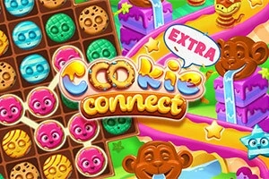 Un tablero colorido con galletas de caras sonrientes y caramelos, junto a un mono y un camino de confitería
