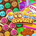 Un tablero colorido con galletas de caras sonrientes y caramelos, junto a un mono y un camino de confitería