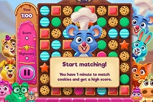 Un tablero colorido con galletas de diferentes formas y colores, un ratón chef sonriente en el centro, y varios animales animados alrededor