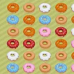 Diferentes donas de colores y decoraciones variadas dispuestas en una cuadrícula sobre un fondo verde con líneas diagonales