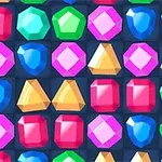 Filas de gemas de colores brillantes en diferentes formas sobre un fondo oscuro
