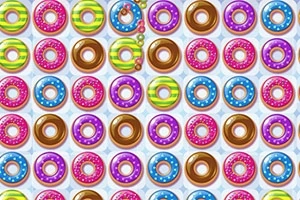 Fila de donas de colores brillantes con glaseados diversos y chispas