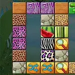 Bloques con patrones de animales y frutas alineados en una cuadrícula colorida