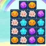 Cuadrícula de piezas coloridas con formas de flores y criaturas sobre un fondo de arcoíris