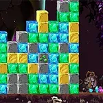 Bloques de colores apilados en una cueva con un personaje barbudo sentado a la derecha junto a gemas y un cántaro