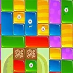 Bloques de colores vibrantes con ojos y caras en un patrón aleatorio