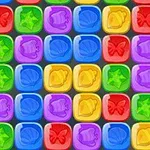 Cuadrícula de bloques de colores con formas de estrellas, mariposas, campanas y conchas