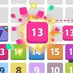 Cuadrícula colorida con números y un bloque rosa resaltado con el número 13 y una mano apuntando a otro bloque similar