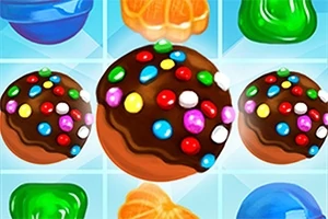 Dulces de chocolate con caramelos de colores sobre un fondo de piezas de caramelo brillantes