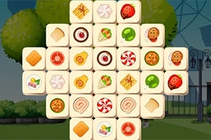 Tablero de fichas cuadradas con imágenes de alimentos y dulces en un jardín