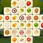 Tablero de fichas cuadradas con imágenes de alimentos y dulces en un jardín